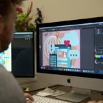 Employee performing graphic design on his computer at Paragon Marketing Group