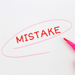 Circling marketing mistakes in pink highlighter