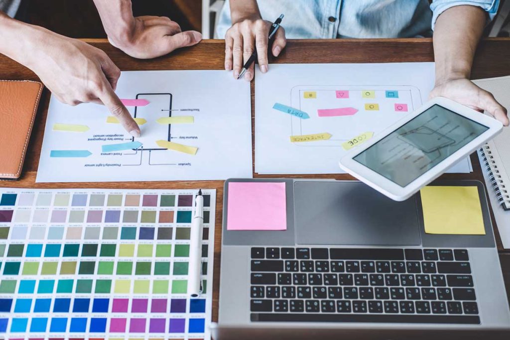 multiple items on a desk reflecting the importance of branding consistency for a business