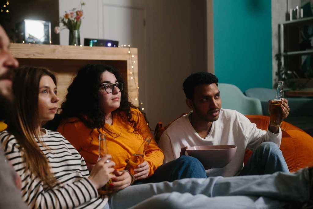 Friends watching a streaming service, demonstrating the power of OTT advertising